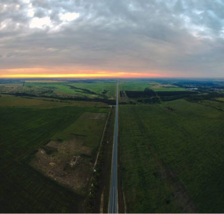View of the track and fields at dawn with quadrocopter View of the track and fields at dawn with quadrocopter